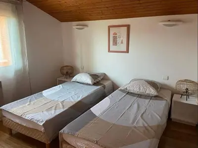 Un ou plusieurs lits dans un hébergement de l'établissement Superbe duplex proche centre et plages