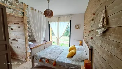 Un ou plusieurs lits dans un hébergement de l'établissement Les Bord'Océanes Sauna & Spa Villa Marensine et Villa Oyat