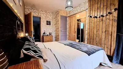 Un ou plusieurs lits dans un hébergement de l'établissement Les Bord'Océanes Sauna & Spa Villa Marensine et Villa Oyat