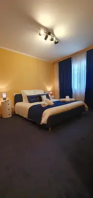Un ou plusieurs lits dans un hébergement de l'établissement Maison charmante