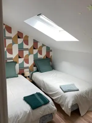 Un ou plusieurs lits dans un hébergement de l'établissement La Chaise Haute