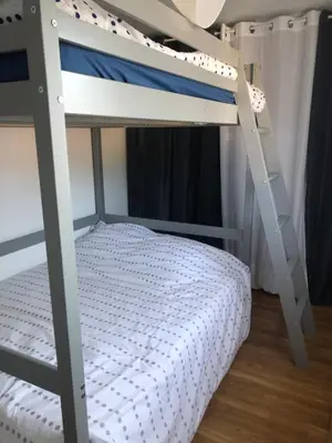 Un ou plusieurs lits dans un hébergement de l'établissement Villa de vacances Vieux Boucau