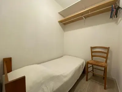 Un ou plusieurs lits dans un hébergement de l'établissement Appartement avec Piscine, Terrasse et Parking à Capbreton, Proche du Port - FR-1-413-198
