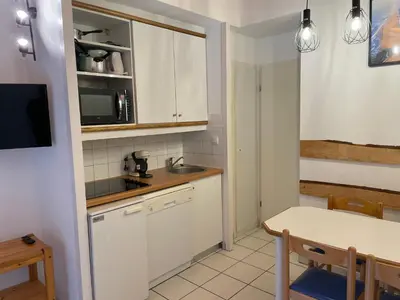 Cuisine ou kitchenette dans l'établissement Séjour Moliets plage