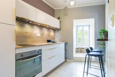 Cuisine ou kitchenette dans l'établissement Le Cœur de Ville - Unique