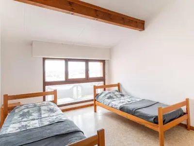 Un ou plusieurs lits dans un hébergement de l'établissement Apartment Belvédère 4 by Interhome