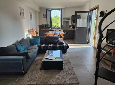 Coin salon dans l'établissement Appartement 4/6 pers, jardin, 6 km de la plage