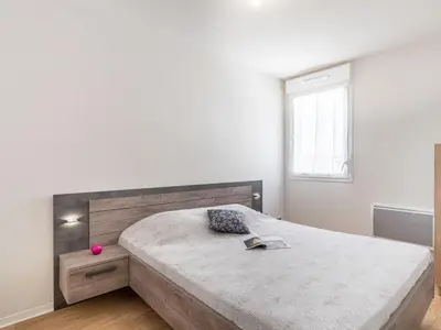 Un ou plusieurs lits dans un hébergement de l'établissement Apartment SC H01 by Interhome