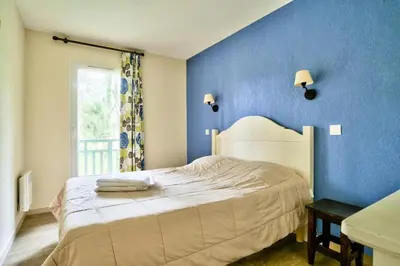 Un ou plusieurs lits dans un hébergement de l'établissement Les Maisons du Domaine du Golf de Pinsolle - maeva Home - Maison 3 pièces 6 personnes - Sélection MAE-9964