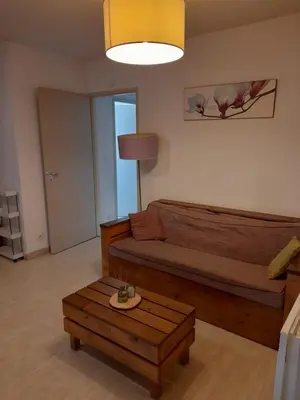 Coin salon dans l'établissement Appartement les Terrasses du Lac