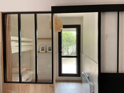 Un ou plusieurs lits dans un hébergement de l'établissement Appartement à Seignosse océan 2 chb et jardin