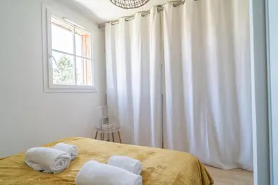 Un ou plusieurs lits dans un hébergement de l'établissement LES RENARDS - Charmante petite maison au port de la Teste