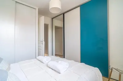 Un ou plusieurs lits dans un hébergement de l'établissement LES RENARDS - Charmante petite maison au port de la Teste