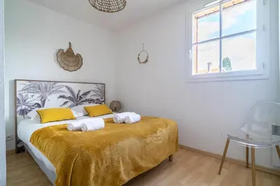 Un ou plusieurs lits dans un hébergement de l'établissement LES RENARDS - Charmante petite maison au port de la Teste