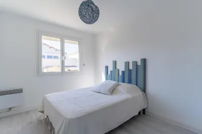 Un ou plusieurs lits dans un hébergement de l'établissement Maison Mimizan plage