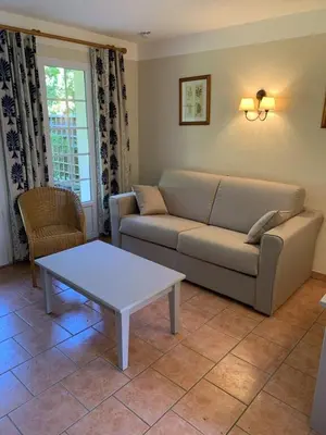 Coin salon dans l'établissement cottage « maison du golf » à Moliets
