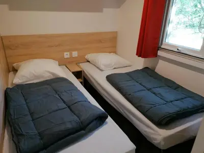 Un ou plusieurs lits dans un hébergement de l'établissement MOBIL-HOME RECENT 6 personnes PAYS BASQUE