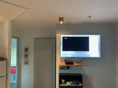 Télévision ou salle de divertissement dans l'établissement Le Green-Center, 2 pièces en Hyper Centre