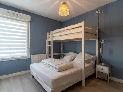 Un ou plusieurs lits dans un hébergement de l'établissement Appartement T3 rénové face à la dune, 6 pers., piscine, plage à pied - Biscarrosse - FR-1-319-489