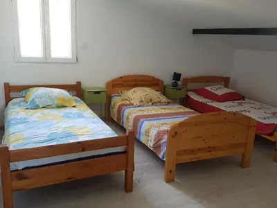 Un ou plusieurs lits dans un hébergement de l'établissement Gîte paisible rénové