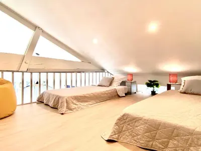 Un ou plusieurs lits dans un hébergement de l'établissement Élégante maison au bord du bassin Arcachon