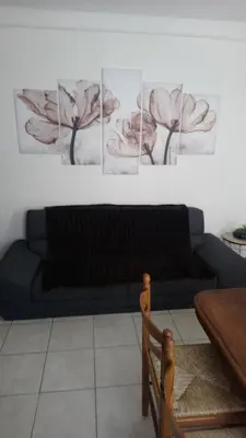 Coin salon dans l'établissement 50 M OCÉAN maison classée 2 étoiles 2/7 personnes