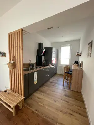 Télévision ou salle de divertissement dans l'établissement Un logement cosy proche des Ports