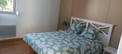Un ou plusieurs lits dans un hébergement de l'établissement chalet Le Ticaco Soustons plage avec WiFi satellite