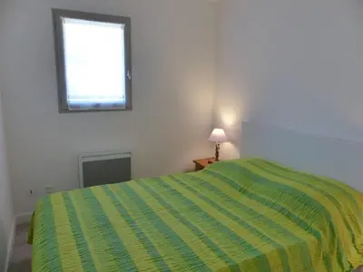 Un ou plusieurs lits dans un hébergement de l'établissement Les Rives de Capbreton Villa patio Résidence pour 4 personnes