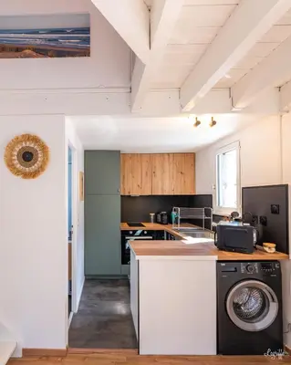 Cuisine ou kitchenette dans l'établissement Magnifique appart à 5 min des plages et commerces