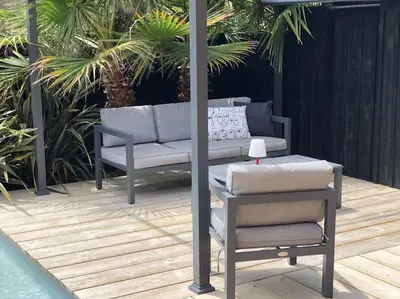 Coin salon dans l'établissement Nanie - Villa centre-ville, piscine, wifi - La Teste de Buch