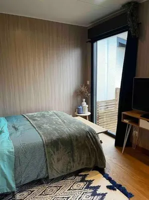 Un ou plusieurs lits dans un hébergement de l'établissement Le Lodge