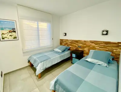 Un ou plusieurs lits dans un hébergement de l'établissement Villa Palot à la plage