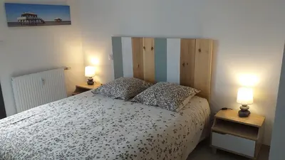 Un ou plusieurs lits dans un hébergement de l'établissement Bel appartement sur le bassin d'Arcachon, à 2km de la mer