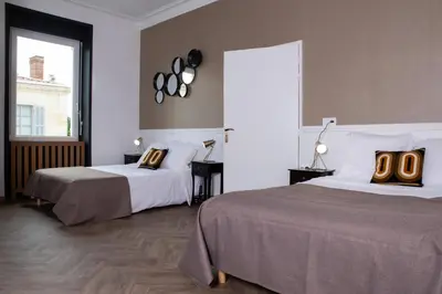 Un ou plusieurs lits dans un hébergement de l'établissement L'Aparté