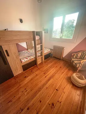 Un ou plusieurs lits dans un hébergement de l'établissement Beach house idéale pour famille, 400 m de l’océan