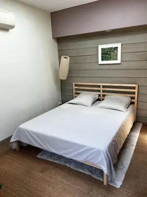Un ou plusieurs lits dans un hébergement de l'établissement Maisonnette de charme près de Capbreton Hossegor