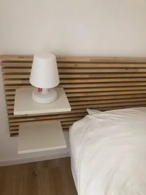 Un ou plusieurs lits dans un hébergement de l'établissement Maison La teste de Buch 3 chambres