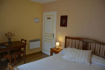 Un ou plusieurs lits dans un hébergement de l'établissement Chambre d'hôtes de la tuilerie