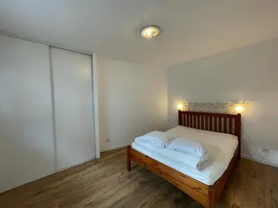 Un ou plusieurs lits dans un hébergement de l'établissement Spacieuse villa avec véranda et jardin à Capbreton - FR-1-413-209