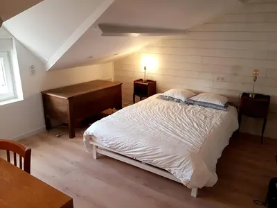 Un ou plusieurs lits dans un hébergement de l'établissement Jolie SUITE de 28m² - LA HUME Centre