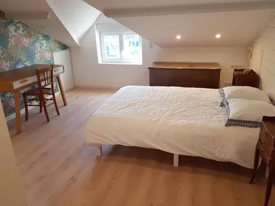 Un ou plusieurs lits dans un hébergement de l'établissement Jolie SUITE de 28m² - LA HUME Centre