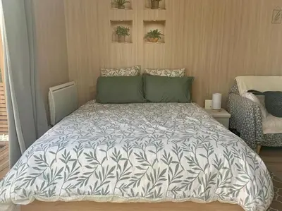 Un ou plusieurs lits dans un hébergement de l'établissement Le Maluti - Chalet climatisé à Hostens