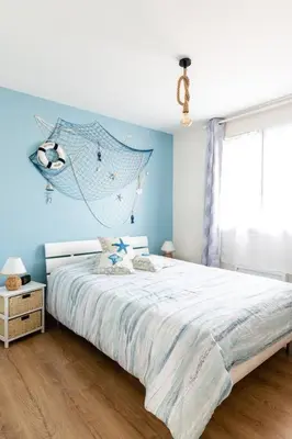 Un ou plusieurs lits dans un hébergement de l'établissement Agréable maison avec extérieur