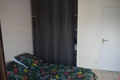 Un ou plusieurs lits dans un hébergement de l'établissement Appartement cosy au calme