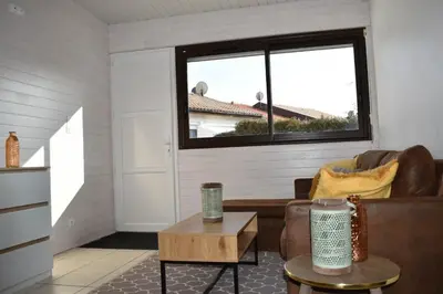 Coin salon dans l'établissement Appartement cosy au calme