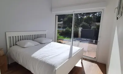 Un ou plusieurs lits dans un hébergement de l'établissement Bassin d'Arcachon belle villa moderne 4 chambres et piscine privée