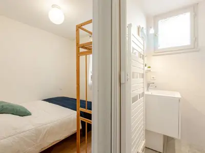 Un ou plusieurs lits dans un hébergement de l'établissement Apartment Les Bourdaines by Interhome
