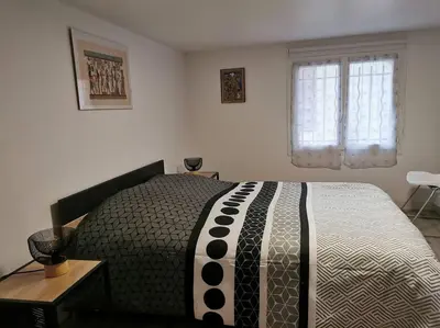 Un ou plusieurs lits dans un hébergement de l'établissement Appartement 5 personnes avec piscine 60m2