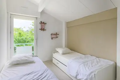 Un ou plusieurs lits dans un hébergement de l'établissement Biscarrosse Lac Duplex avec jardin 6 personnes